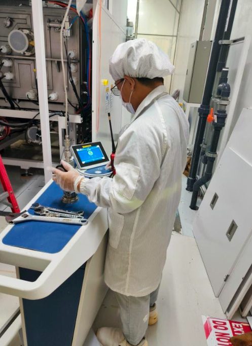 Helium leak detector connected to a semiconductor tool hook-up line